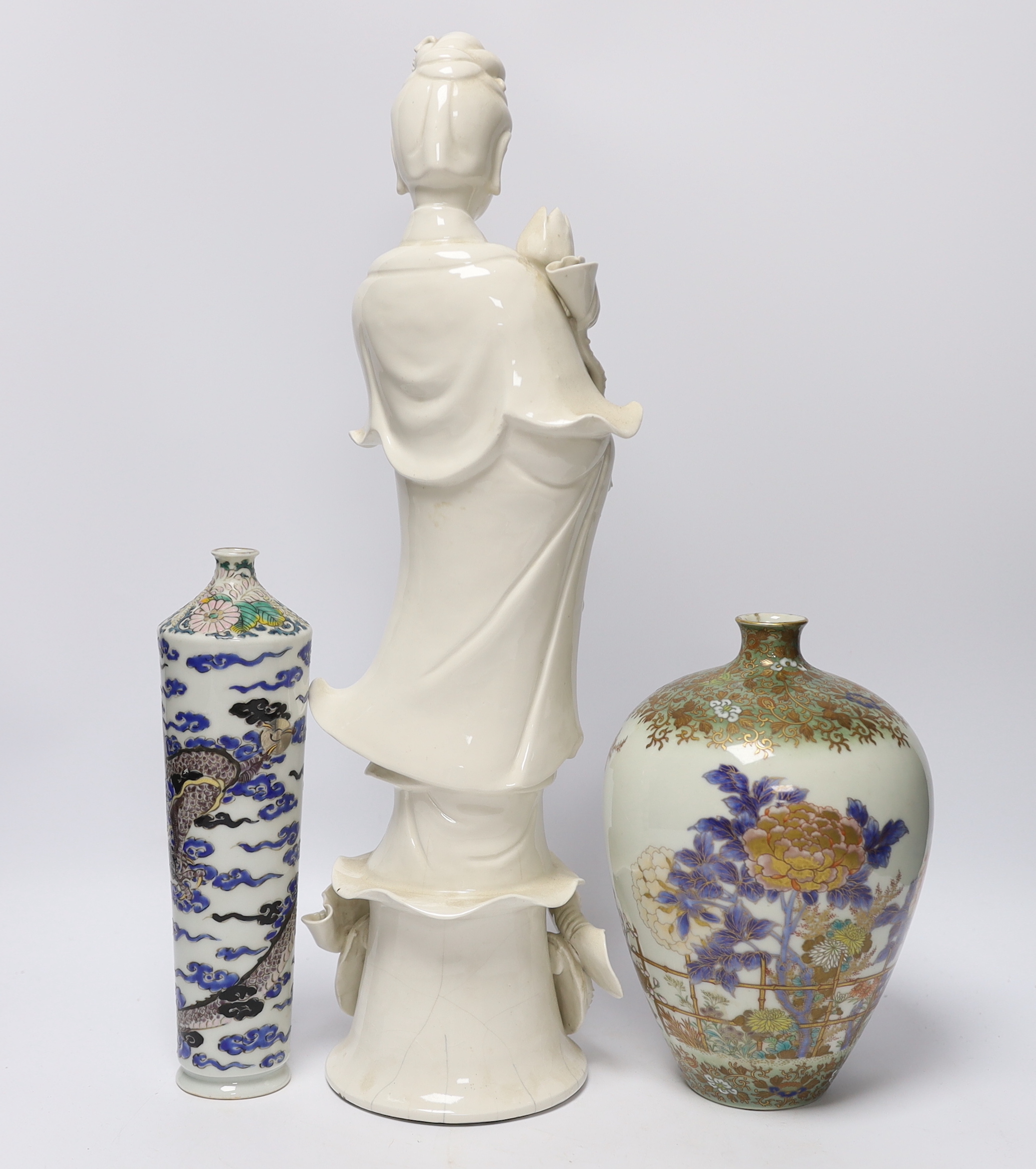 A 19th century Chinese blanc de chine figure of Guanyin, 20th century ‘dragon’ vase and a Japanese Meiji period vase, by Fukagawa, koransha mark, tallest 46.5cm